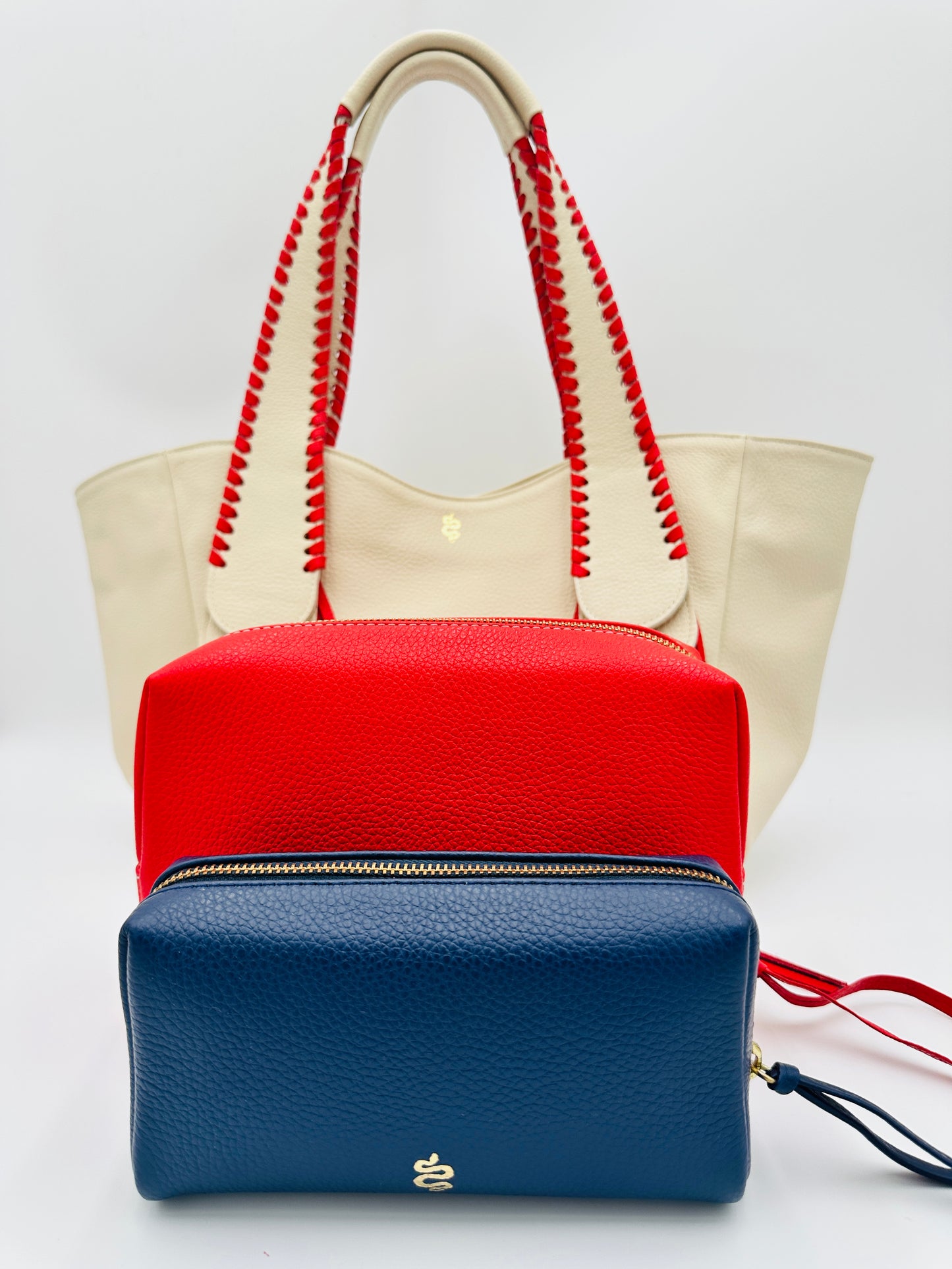 Small Makeup Bag in Navy with a Bright Red Interior