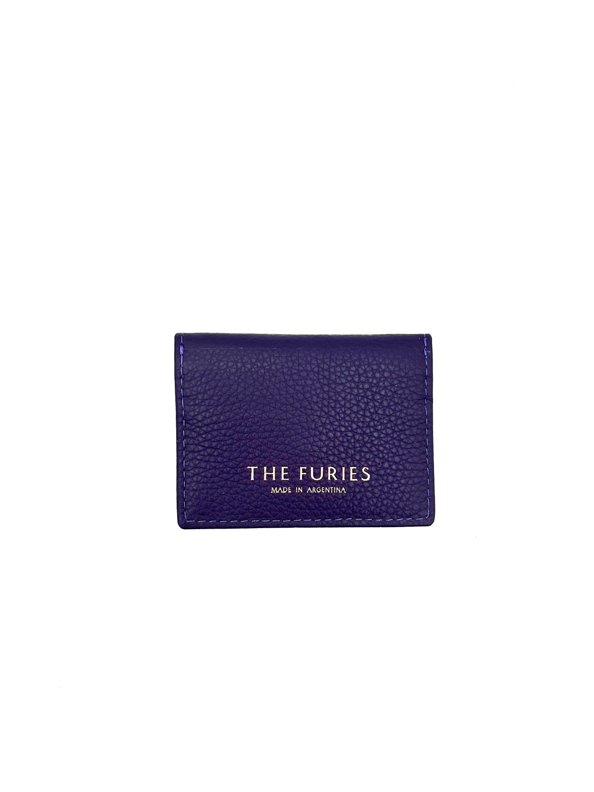 The back of a purple leather card case with "the furies" brand name and "made in Argentina" written in gold foil.
