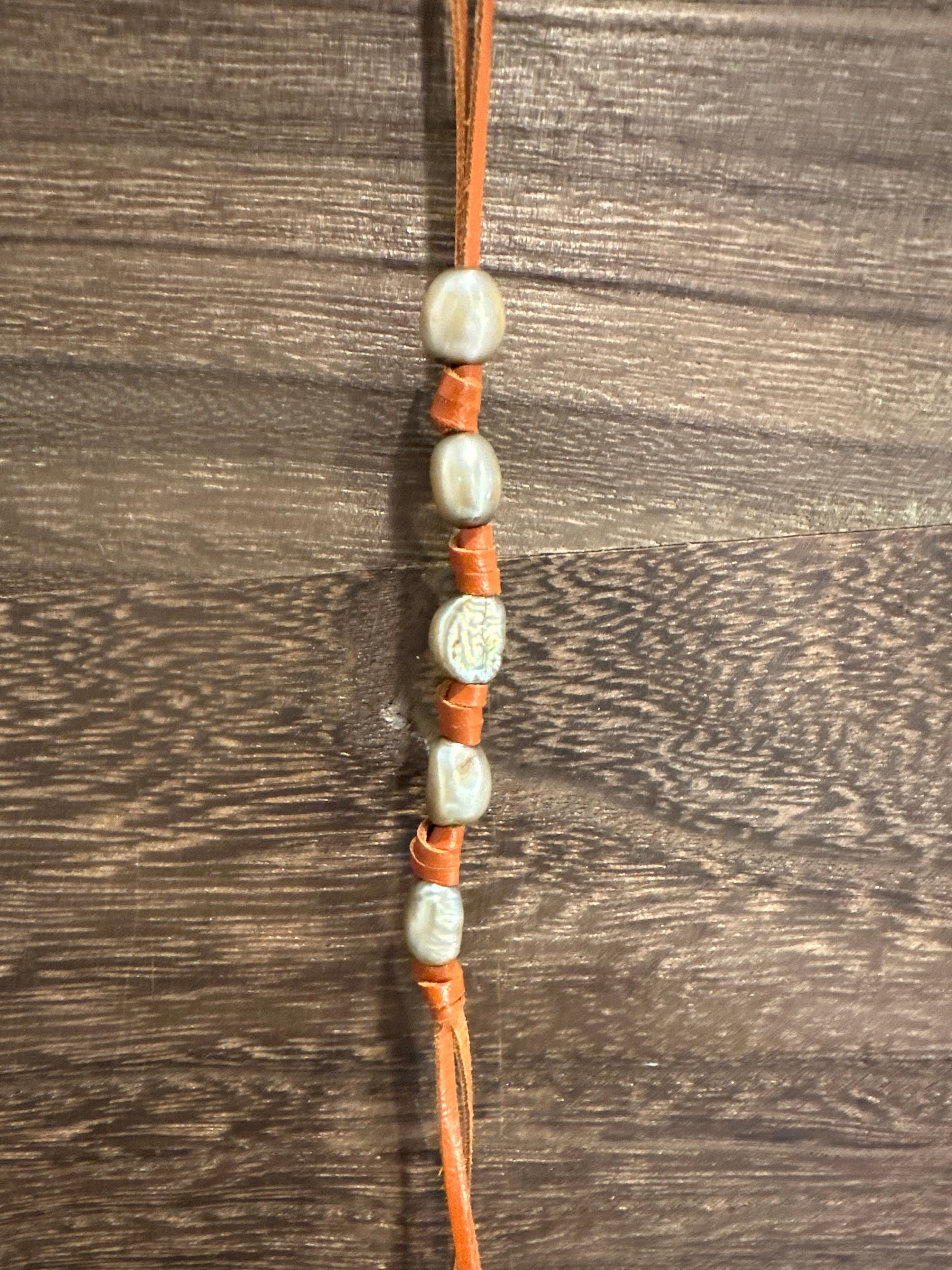 The Lady with a Pearl (Cognac) bag charm from The Furies Collective — beaded charm on leather lace for handbag styling.