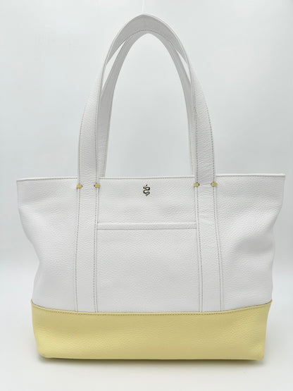 The Large Carolyn tote handbag from The Furies Collective in Snow with Canary Yellow Base — saturated pebble leather with thick handles and zipper top closure.