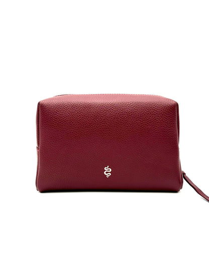 The Large Accessories Bag from The Furies Collective in Claret with a Raspberry Interior — pebble leather travel pouch lined in contrast color.