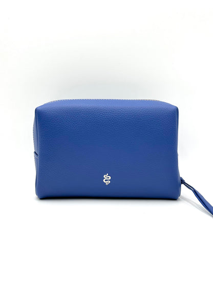 The Large Accessories Bag from The Furies Collective in Sapphire with a Silver Interior — pebble leather travel pouch lined in contrast color.