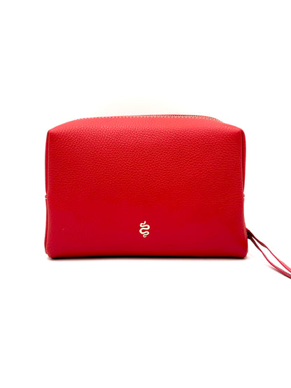 The Large Accessories Bag from The Furies Collective in Lipstick Red with a Silver Interior — pebble leather travel pouch lined in contrast color.