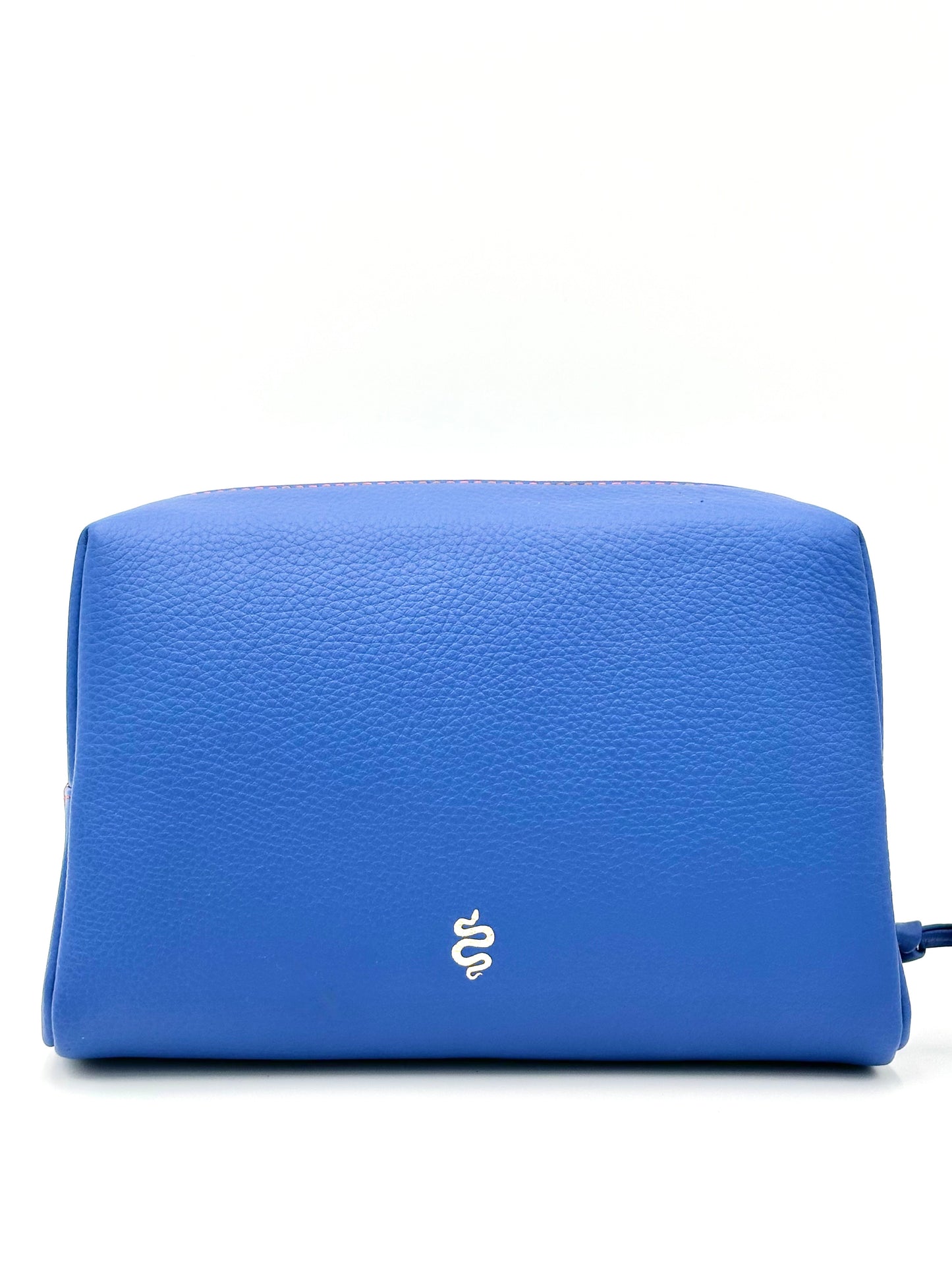 The Large Accessories Bag from The Furies Collective in Sapphire with a Bright Orange Interior — pebble leather travel pouch lined in contrast color.