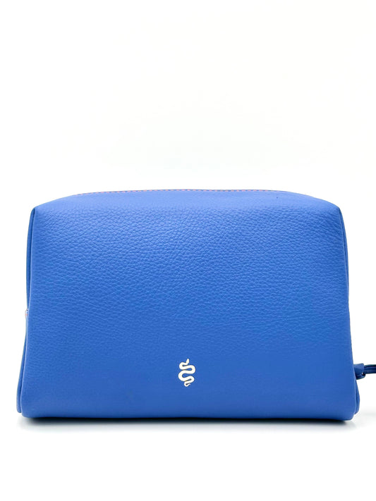 The Large Accessories Bag from The Furies Collective in Sapphire with a Bright Orange Interior — pebble leather travel pouch lined in contrast color.