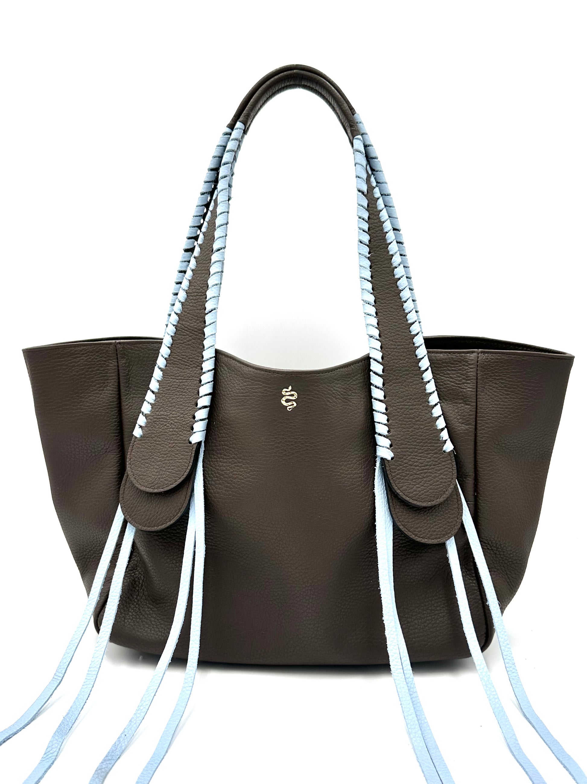 The Talitha tote handbag from The Furies Collective in Espresso with Sky Blue Lacing — pebble leather with whipstitched fringe handles and the Furies snake logo.