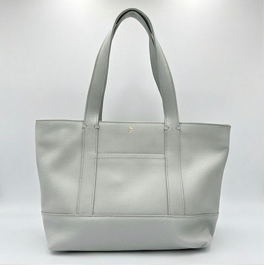 The Large Carolyn tote handbag from The Furies Collective in Grey Clouds — saturated pebble leather with thick handles and zipper top closure.