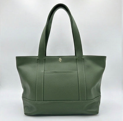 The Large Carolyn tote handbag from The Furies Collective in Holly Green — saturated pebble leather with thick handles and zipper top closure.