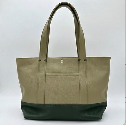 The Large Carolyn tote handbag from The Furies Collective in Lichen with Holly Green Base — saturated pebble leather with thick handles and zipper top closure.