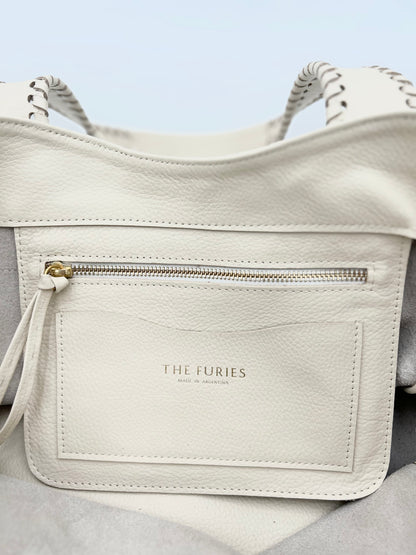 Off white handbag interior pocket with zipper and cardholder.