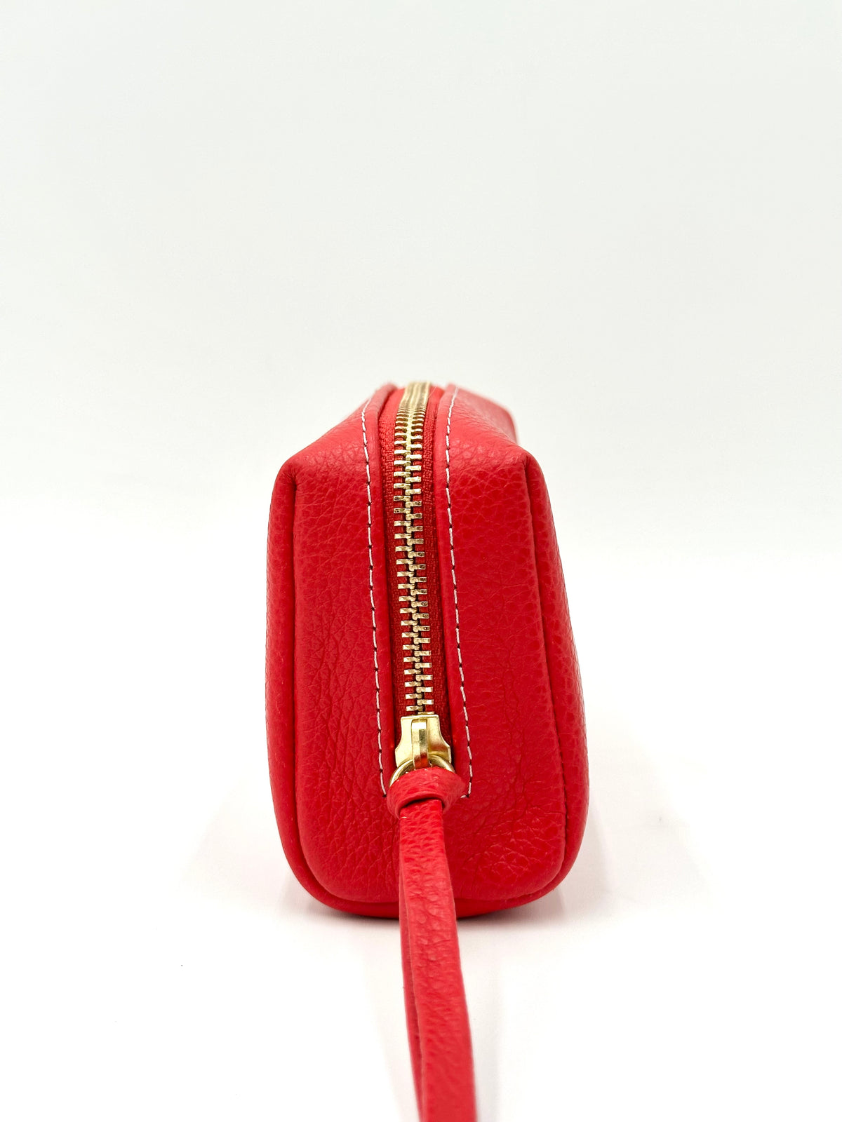 Red pouch with a gold zipper on a white background